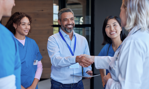 mature-woman-doctor-shaking-hands-with-pharmaceuti-2025-01-10-04-29-29-utc 3